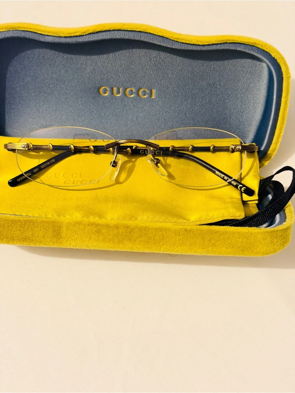 Gucci Rimless Men's Glasses in Black and Gold Accents